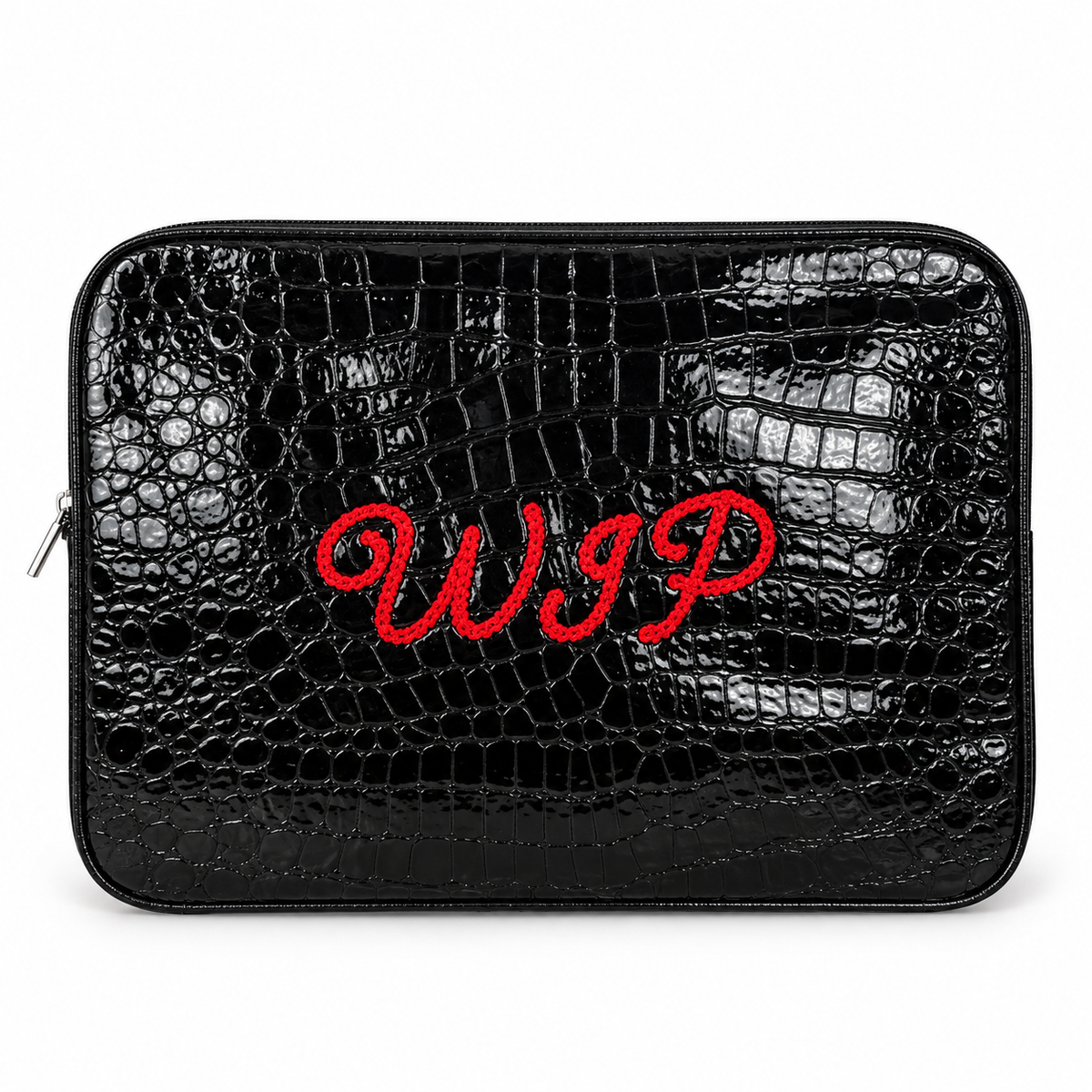 A black crocodile-embossed zippered pouch with red embroidered cursive initials 'WIP' on the front, shown against a plain white background.