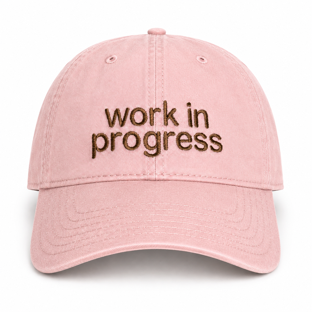 Dusty rose dad hat with chocolate brown sans Work in Progress embroidery